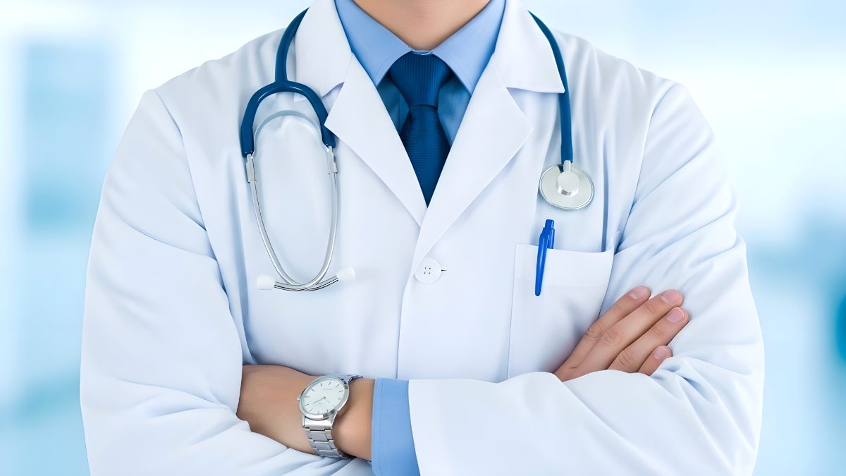Professional doctor wearing white lab coat with stethoscope standing in hospital clinic environment stock photo