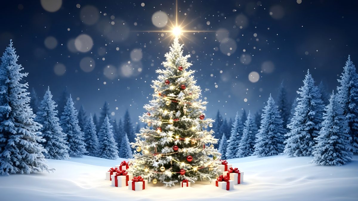 Decorated christmas tree with glowing lights and gift boxes in a snowy winter forest at night stock photo